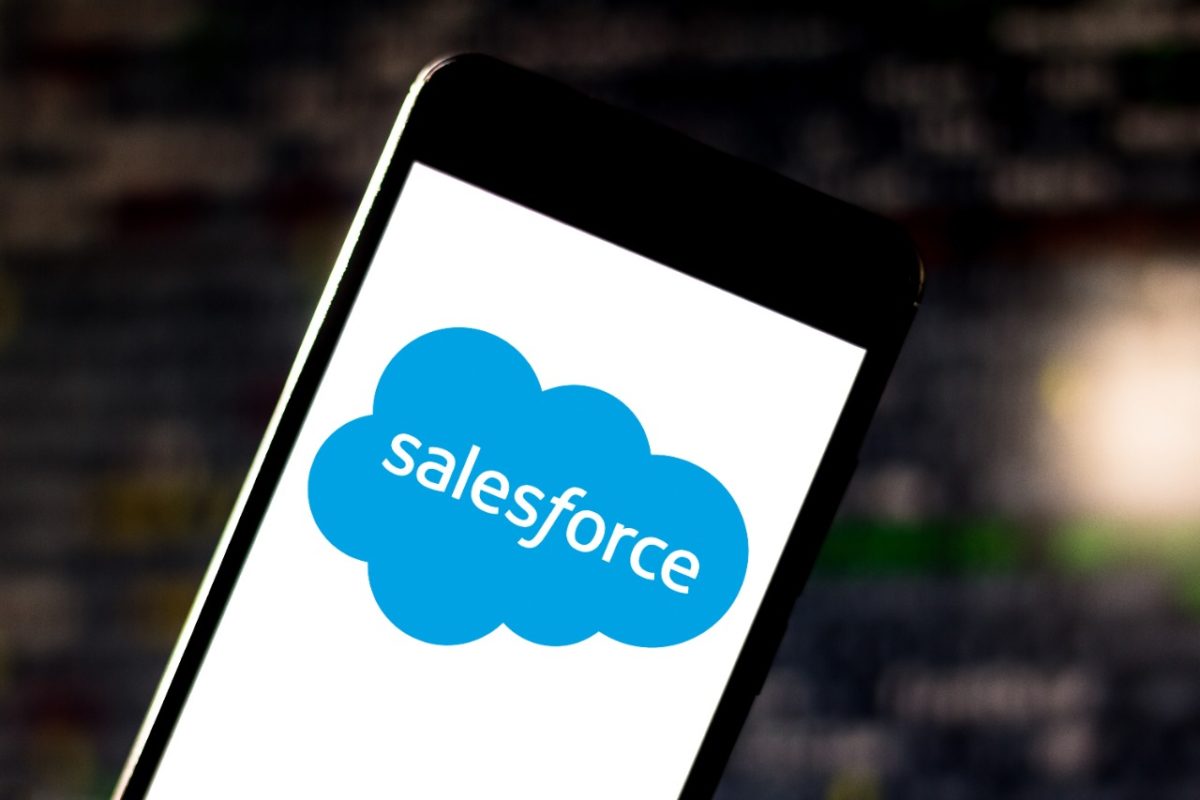 a mobile showing a text inside clouds written salesforce